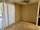 Cozy dining room space with neutral carpet and bright natural light provided by sliding glass door at 7912 Foxwood Pl # 104, Las Vegas, NV 89145