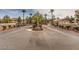 Welcoming community entrance with gated access and lush greenery at 7912 Foxwood Pl # 104, Las Vegas, NV 89145
