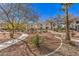 Beautifully landscaped grounds with walking paths and mature trees at 7912 Foxwood Pl # 104, Las Vegas, NV 89145