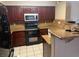 Well-equipped kitchen with stainless steel appliances, granite countertops, and tile flooring at 7912 Foxwood Pl # 104, Las Vegas, NV 89145