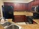 Well-equipped kitchen with stainless steel appliances, granite countertops, and tile flooring at 7912 Foxwood Pl # 104, Las Vegas, NV 89145