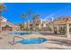 Inviting pool area with hot tub, surrounded by lush landscaping at 7912 Foxwood Pl # 104, Las Vegas, NV 89145