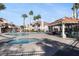 Community pool with hot tub and covered seating area for residents at 7912 Foxwood Pl # 104, Las Vegas, NV 89145