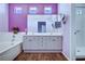 Bright bathroom with a double sink vanity, soaking tub and shower with luxury vinyl plank flooring at 7920 Aviano Pines Ave, Las Vegas, NV 89129