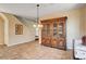 Bright dining area featuring tile flooring, traditional furnishings and staircase nearby at 7920 Aviano Pines Ave, Las Vegas, NV 89129