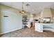 Open kitchen showcases tile floors, and white cabinets at 7920 Aviano Pines Ave, Las Vegas, NV 89129