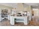 Kitchen showcases gas cooktop, bright white cabinets and tile floors at 7920 Aviano Pines Ave, Las Vegas, NV 89129
