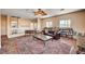 Upstairs living room with wood floors, area rug, and bright natural light at 7920 Aviano Pines Ave, Las Vegas, NV 89129