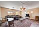Comfortable living room with wood floors, area rug, and bright natural light at 7920 Aviano Pines Ave, Las Vegas, NV 89129