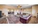 Upstairs living room with wood floors, sliding mirror closet, and ceiling fan at 7920 Aviano Pines Ave, Las Vegas, NV 89129