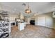 Open living space features stairs, piano, and bright airy kitchen at 7920 Aviano Pines Ave, Las Vegas, NV 89129