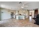 Expansive living space features staircase, piano, and kitchen island at 7920 Aviano Pines Ave, Las Vegas, NV 89129