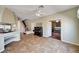 Open living space with stairs, piano, and view into another room at 7920 Aviano Pines Ave, Las Vegas, NV 89129