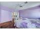 Large bedroom with wood floors, ensuite bathroom, and lots of light at 7920 Aviano Pines Ave, Las Vegas, NV 89129