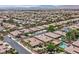 Aerial view of a landscaped home featuring a private swimming pool, yard and beautiful neighborhood at 7986 Merlewood Ave, Las Vegas, NV 89117
