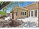 Backyard patio with a decorative fountain, mature trees, and tranquil landscaping at 7986 Merlewood Ave, Las Vegas, NV 89117