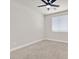 Bright bedroom with carpeting, ceiling fan, and window creating a bright and simple interior space at 7986 Merlewood Ave, Las Vegas, NV 89117