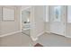 Open foyer showcasing a glimpse into the bedroom and front entry door at 7986 Merlewood Ave, Las Vegas, NV 89117
