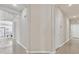 Hallway with tile flooring leading to the kitchen and a separate door to another area of the home at 7986 Merlewood Ave, Las Vegas, NV 89117