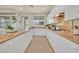 Bright kitchen with white cabinetry, granite counters, and a functional layout perfect for cooking and entertaining at 7986 Merlewood Ave, Las Vegas, NV 89117