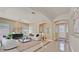 Bright and airy living room with neutral decor and tiled floors at 7986 Merlewood Ave, Las Vegas, NV 89117