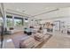 Open-concept living area with kitchen and dining area in the background at 7986 Merlewood Ave, Las Vegas, NV 89117