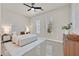 Bright bedroom with recessed lighting, ceiling fan, and ensuite bathroom at 7986 Merlewood Ave, Las Vegas, NV 89117
