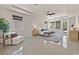 Spacious bedroom boasts tile flooring, recessed lighting, seating area, and backyard access at 7986 Merlewood Ave, Las Vegas, NV 89117