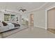 Bright bedroom offers recessed lighting, backyard access, ceiling fan, and ensuite bathroom at 7986 Merlewood Ave, Las Vegas, NV 89117