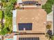 Birds eye view of a roof fitted with solar panels alongside a manicured lawn and patios at 8089 Black Orchid Ave, Las Vegas, NV 89131