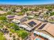 Nevada home featuring solar panels, covered patio, manicured yard, and beautiful desert neighborhood at 8089 Black Orchid Ave, Las Vegas, NV 89131