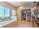 Bathroom featuring a tub, shower, and large closet at 8089 Black Orchid Ave, Las Vegas, NV 89131