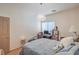 Bedroom with modern lighting fixture, hardwood floors, and natural light at 8089 Black Orchid Ave, Las Vegas, NV 89131