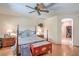 Neutral bedroom featuring a ceiling fan and lots of natural light at 8089 Black Orchid Ave, Las Vegas, NV 89131