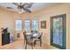 Cozy dining area with a round table, natural light, and a view of the decorative glass door at 8089 Black Orchid Ave, Las Vegas, NV 89131
