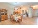 Traditional dining room with tile flooring, chandelier lighting, and decorative furnishings creating a welcoming atmosphere at 8089 Black Orchid Ave, Las Vegas, NV 89131