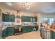 Spacious kitchen with tiled floors, stainless steel appliances, and granite counters at 8089 Black Orchid Ave, Las Vegas, NV 89131
