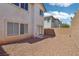 Private backyard with a sliding glass door, a brick wall, and desert landscaping at 914 Appaloosa Hills Ave, North Las Vegas, NV 89081