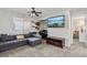 Comfortable entertainment room with a piano, guitars, and a cozy sectional sofa at 914 Appaloosa Hills Ave, North Las Vegas, NV 89081