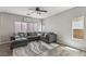 Comfortable living room with an oversized sectional couch and warm natural lighting at 914 Appaloosa Hills Ave, North Las Vegas, NV 89081
