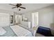 Light and airy main bedroom with a plush tufted bed, dresser, and ensuite access at 914 Appaloosa Hills Ave, North Las Vegas, NV 89081