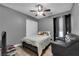 This bedroom features a ceiling fan and neutral walls at 9141 Careful Canvas Ave, Las Vegas, NV 89149