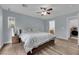 Spacious bedroom with a ceiling fan and natural light at 9141 Careful Canvas Ave, Las Vegas, NV 89149