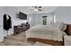 Cozy bedroom with a mounted TV and natural lighting at 9141 Careful Canvas Ave, Las Vegas, NV 89149