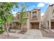Charming home with a cozy front porch, balcony, and an attached single-car garage at 9141 Careful Canvas Ave, Las Vegas, NV 89149