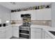 Modern kitchen with stainless steel appliances, a backsplash, white cabinets, and stylish countertops at 9141 Careful Canvas Ave, Las Vegas, NV 89149