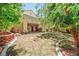 Spacious backyard featuring mature landscaping and a patio with a hot tub at 9520 Rancho Palmas Dr, Las Vegas, NV 89117