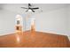 Bright bedroom with hardwood floors and a view of the en-suite bathroom at 9520 Rancho Palmas Dr, Las Vegas, NV 89117