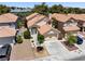 Charming home boasts a tile roof, well-manicured landscaping, and a two-car garage at 9520 Rancho Palmas Dr, Las Vegas, NV 89117