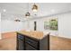Elegant kitchen island featuring granite countertops and pendant lighting at 9520 Rancho Palmas Dr, Las Vegas, NV 89117